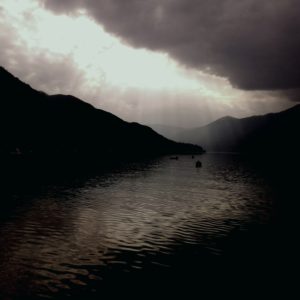 Dramatic light above the dark lake Dramatic light above the dark lake